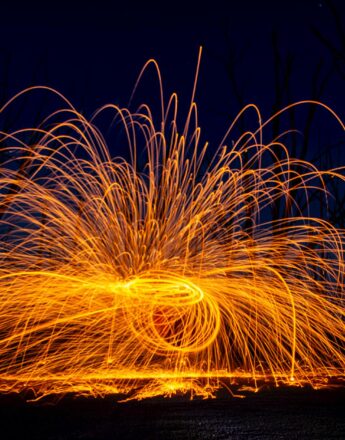 stunning long exposure of steel wool sparklers at night